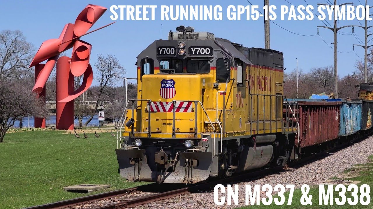 Street Running Train Passes Rockford Symbol, CN M337, & CN M338