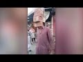 Footage: Man lifts bricks with teeth