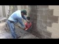 Cutting concrete block with diamond chainsaw