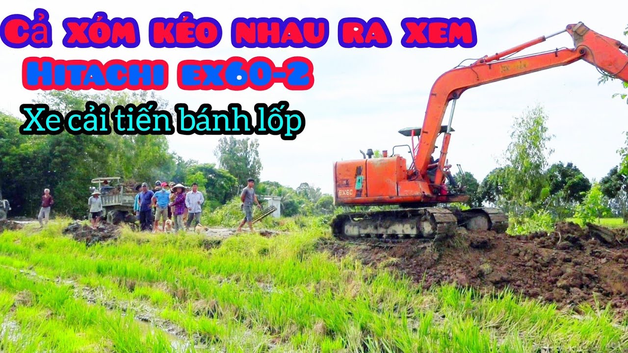 xe cuốc HITACHI EX60-2 múc đất lên xe cải tiến bánh lốp chở đất lấp mương