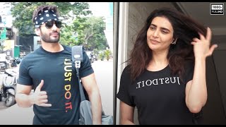 Karishma Tanna Looks Fresh In A Black Top & Orange Tight Leggings. Karan Tacker At The Gym