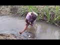 AFRICAN GIRL BATHING IN THE RIVER IN THE VILLAGE