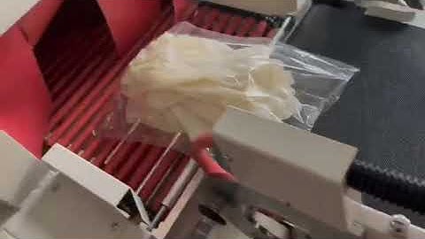 Automatic gloves shrink wrapping packing machine