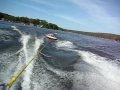 Yuval David clings on while tubing on Lake Mohawk