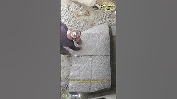 The worker used a large iron hammer to break the granite into four pieces
