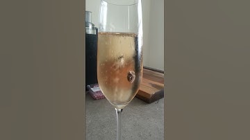 Raisin in a glass of champagne