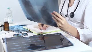 Doctor Examining X-ray Of Lungs Stock Video screenshot 3