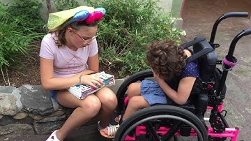 Madi and Angela talking using PODD