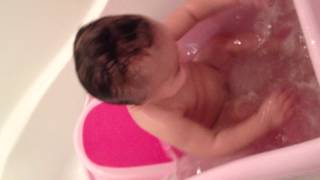 Madison enjoying the bath: 7 months