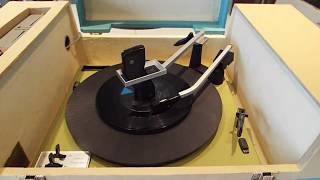 Silvertone 4 speed automatic STEREO record player playing a stack of 45's.