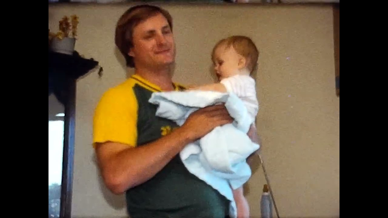 1985 Jacob walking, waving, kissing, 4th of July at cabin