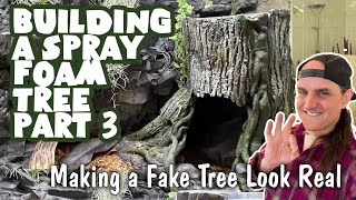 DIY tree trunk using Great Stuff spray foam (found in the caulking aisle),  concrete tube molds, and spray paint (Rustoleum Camou…
