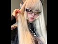 Style of hair show that blends Y2K and cyberpunk wearing sunglasses and headphone
