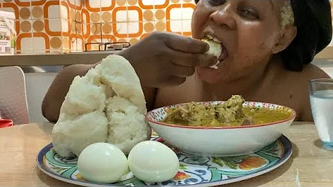 Eating peanut soup and pounded yam