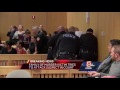 Murder victim's relative lunges at suspect in courtroom melee
