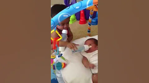 Izaiah feeding Michael