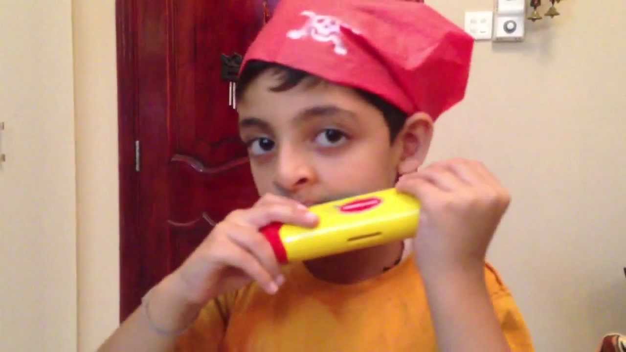 Child playing mouth organ music kids musickids dubai 