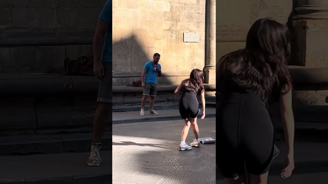 An opera singer beautifully singing O Sole Mio in the streets of Florence, Italy
