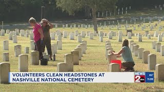Volunteers clean headstones at Nashville National Cemetery