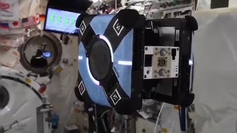 Free-flying Astrobee robots performing service in Space Station