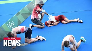 Male triathletes compete under temperatures of 29 degrees Celsius as Norwegian takes gold