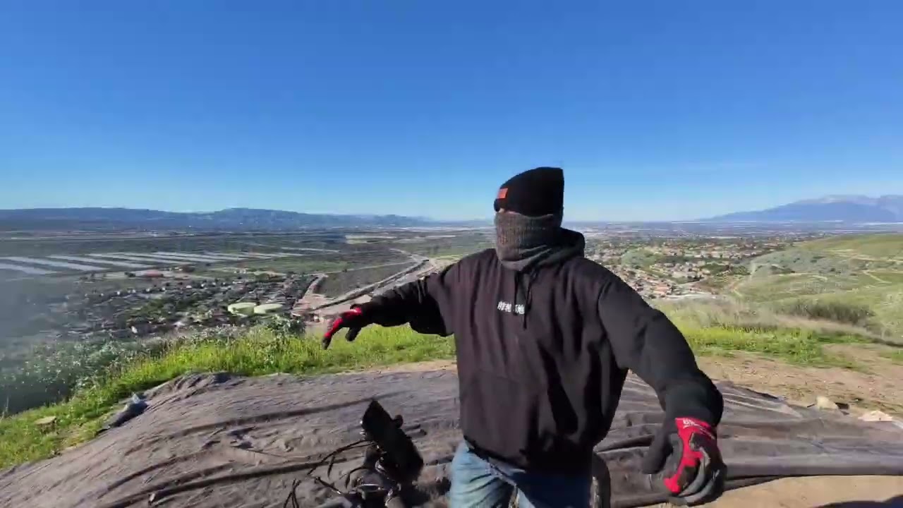 Riding the Bonnell 775 MX Electric MTB up and down A hill with A HoverAir X1 ProMax drone.