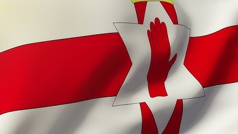 North Ireland Flag Waving In The Wind. Looping Sun Rises Style. Animation Loop Stock Animation