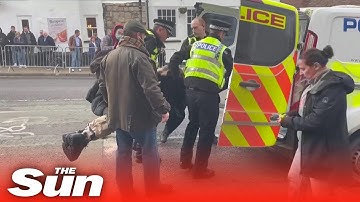 Police pounce and arrest protester who throw eggs towards King Charles