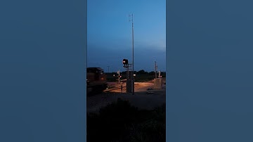 Intermodal knocks down an approach limited signal at night #drone #train #signals