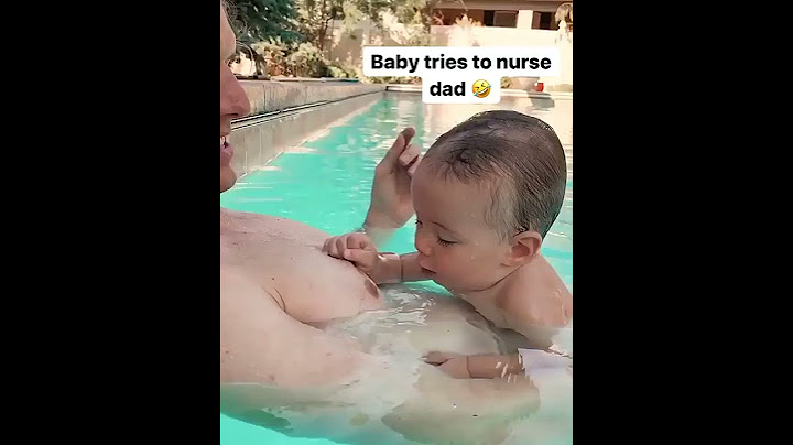 The baby tries drinking milk from his Dad. 😂😂😂