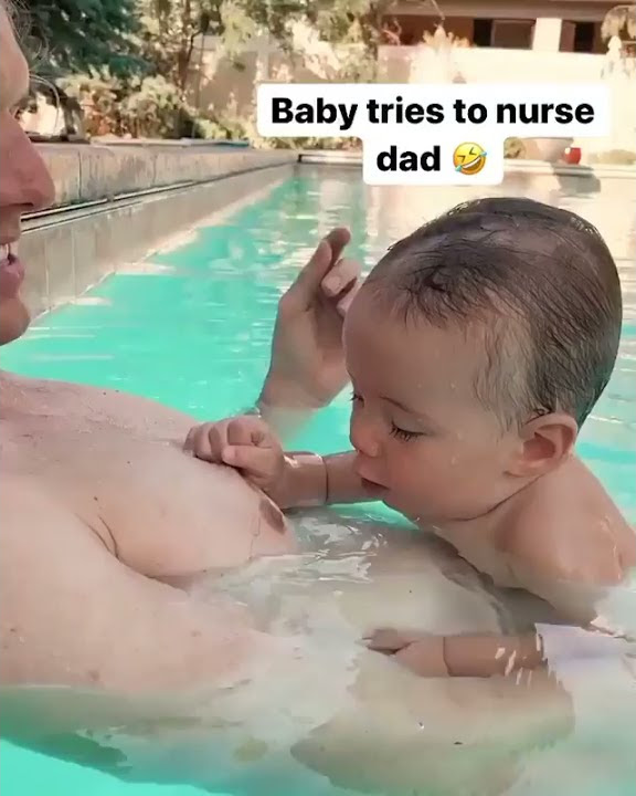 The baby tries drinking milk from his Dad. πππ