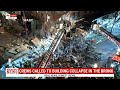 Emergency services search through scene of partial building collapse in the Bronx