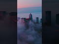 Drone view of NYC Skyscrapers from above the clouds.
