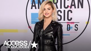 Selena gomez shocked fans with platinum tresses while walking the red
carpet solo at 2017 american music awards. star looked chic in a
leather mini w...