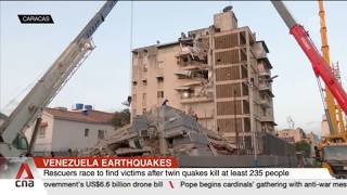 Rescuers race to find victims after twin quakes in Venezuela kill at least 235 people