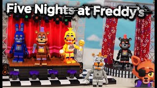 FNAF Pizzeria Simulator McFarlane Toys Stage Playsets - Deluxe Concert, Star Curtain, Salvage Room