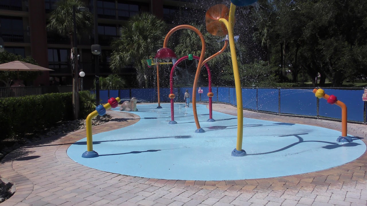 ayden playing on the splash pad at the clarion inn suites in orlando