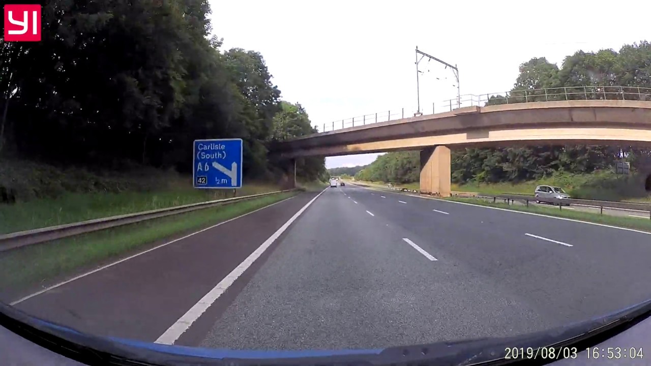 Chance film capture of Virgin West Coast Mainline Train crossing M6 near Carlisle England 3.8.19