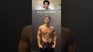 reviewing his back + biceps workout as a fitness coach