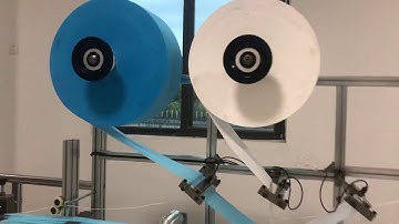 Fabric roll installation guide of flat face mask machine