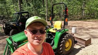 John Deere 3025e back blade work at the woods