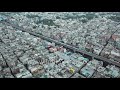 Laxmi nagar delhi aerial view of crowded metropolis in india with metro train tracks