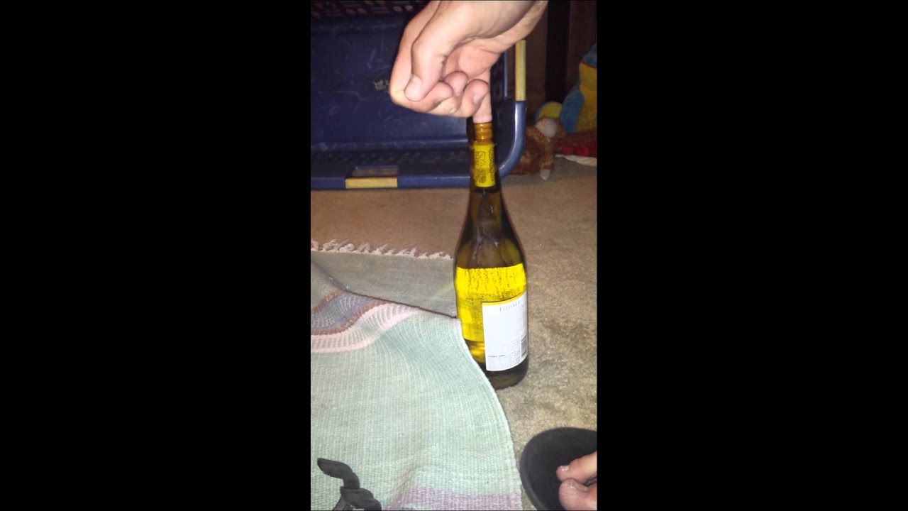 How to open a wine bottle without a corkscrew - YouTube