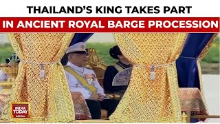 Thailand's king takes part in ancient royal barge procession in Bangkok
