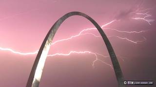 Lightning fills the sky behind the Gateway Arch in St Louis