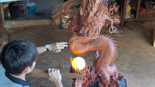 : The carving process turns the tree stump into a dragon statue