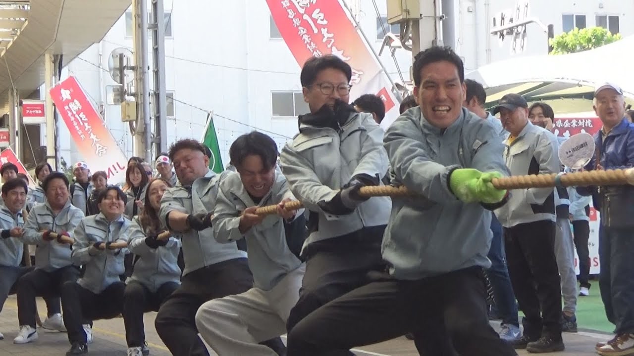 Tug-of-war competition between companies held in a shopping