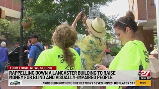 Rappelling down a Lancaster building to raise money for visually-impaired people