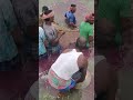 পুকুরের মাছে ঔষুধ দেওয়া হচ্ছে ।