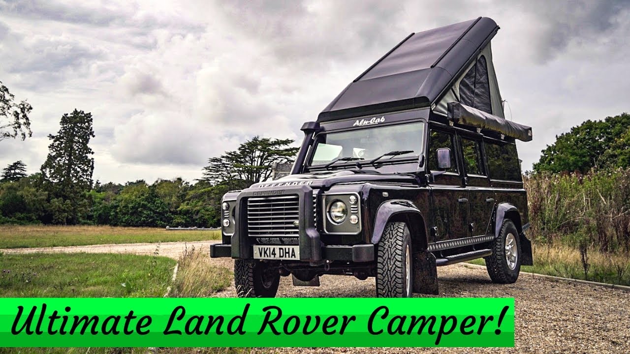 Land Rover Defender Camping With A Tent On The Roof Stock Photo ...